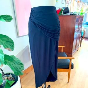 Never worn Black Cabi Maxi Skirt. Jersey. Slimming ruching around waste.  Size M